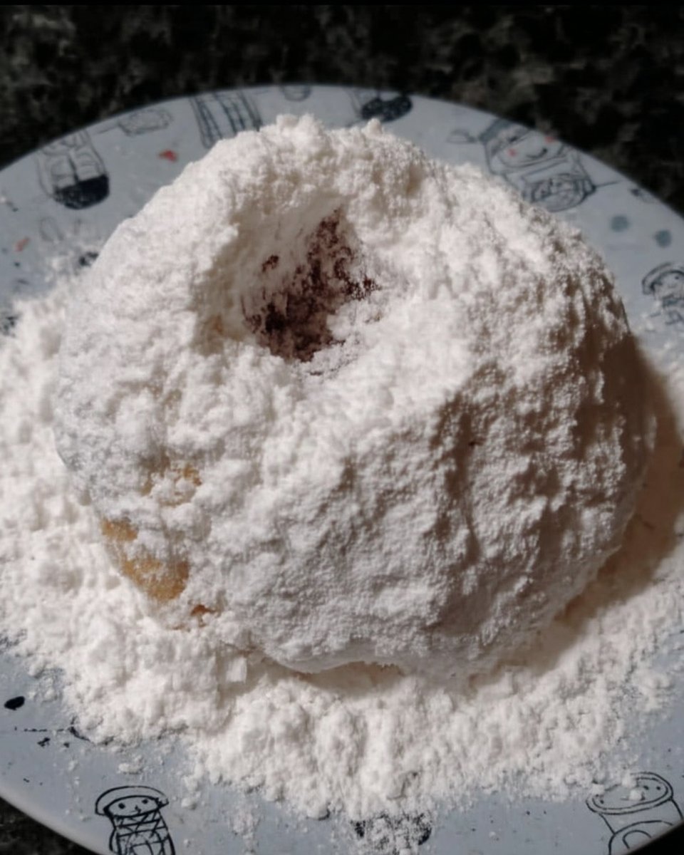 Shaped Kourabiedes dough balls on a baking sheet