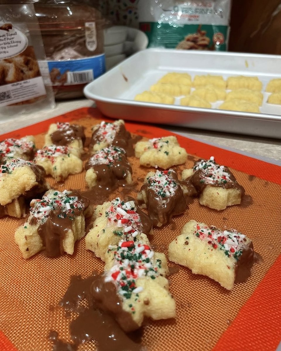 Perfect butter spritz cookies on a cooling rack showing tender texture