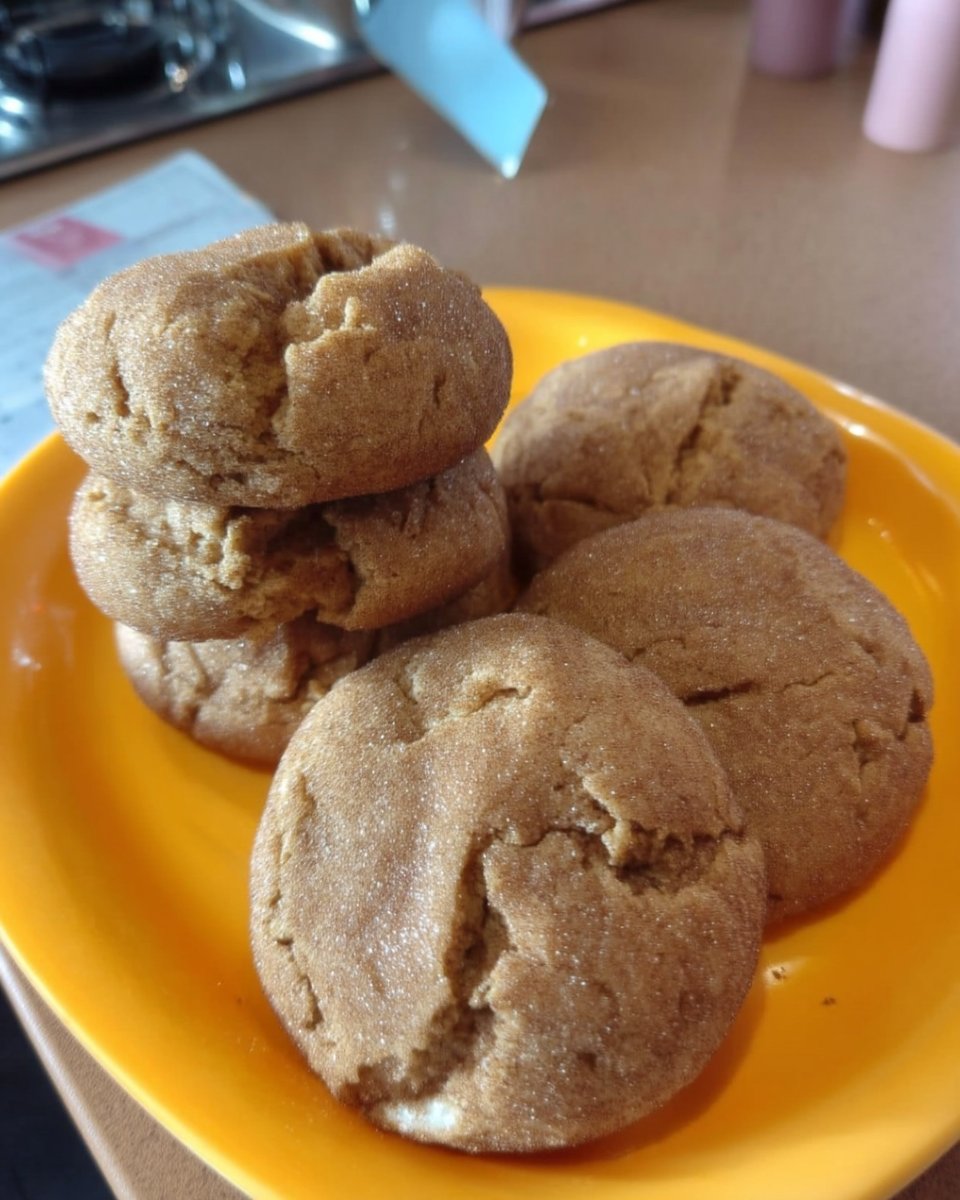 Gluten free snickerdoodles served on a plate with a cup of tea