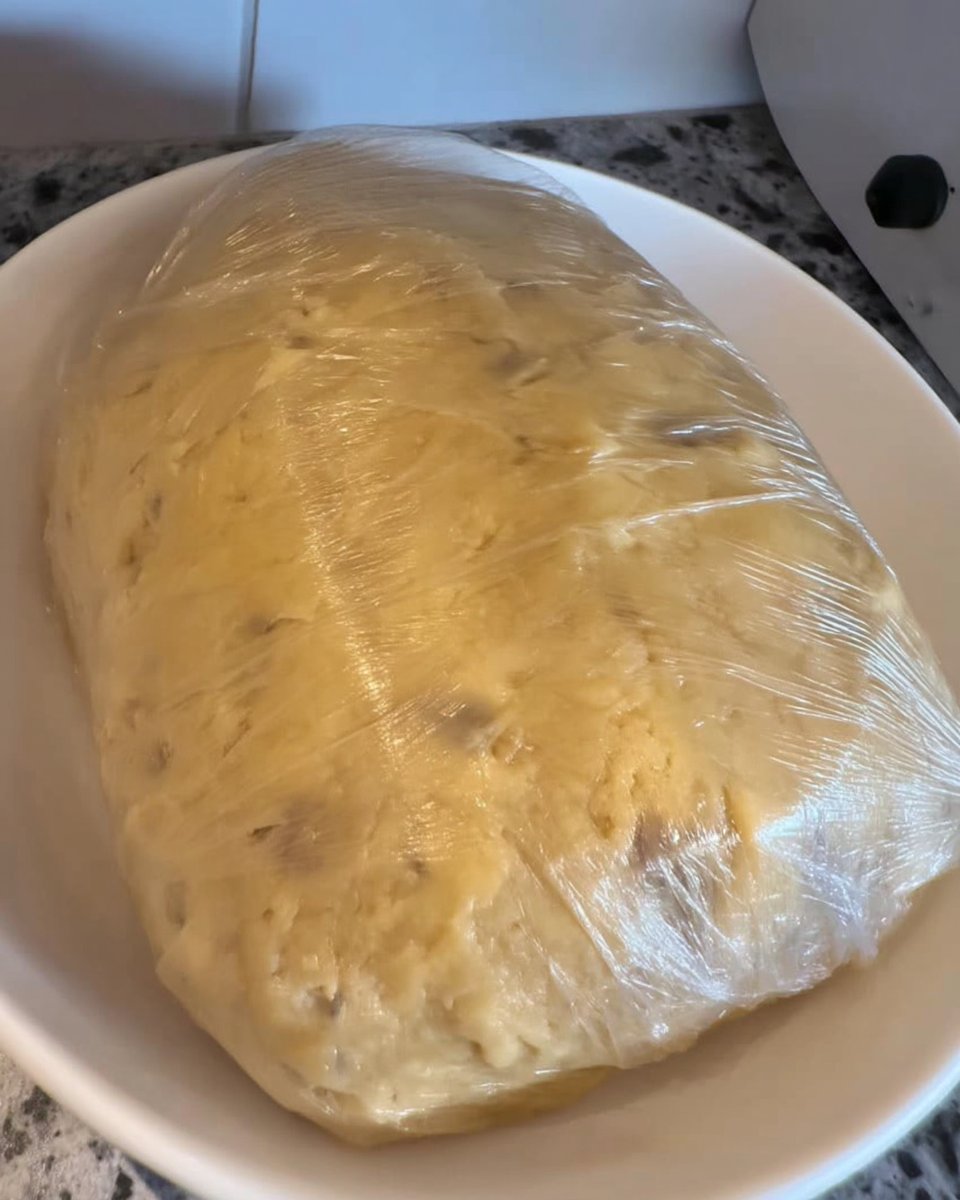 Bowls of weighed flour, ground pecans, and butter on a kitchen scale