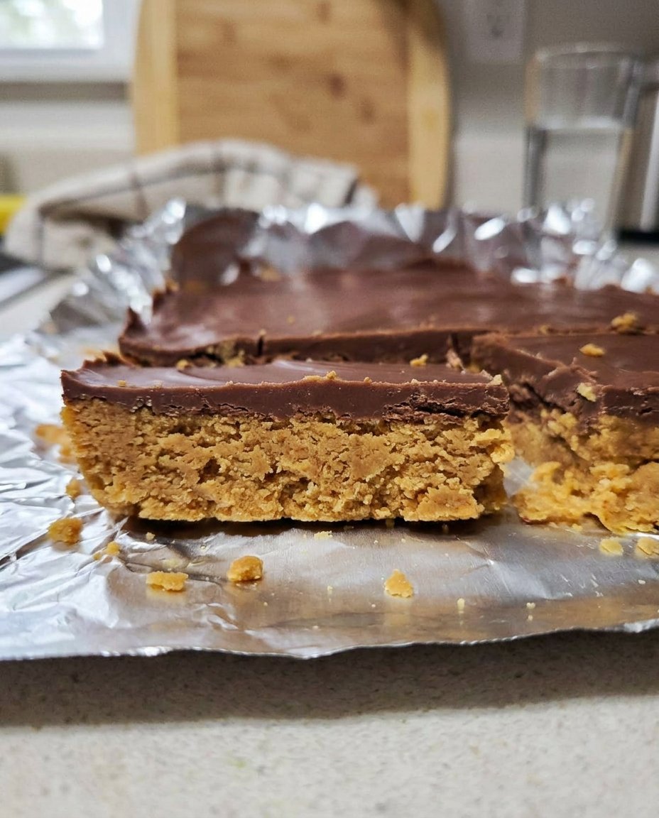 A close up of a Peanut Butter No Bake cookie showing the oat structure and glossy finish
