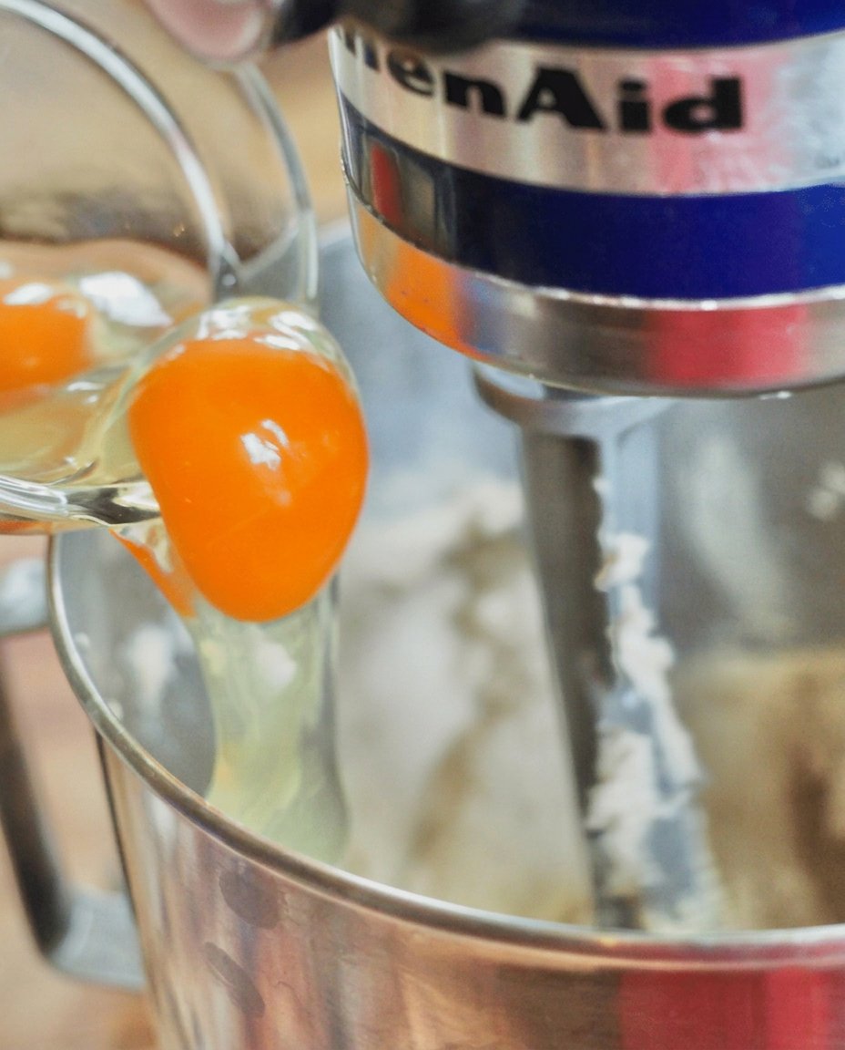 Individual balls of yeast-leavened stroopwafel dough resting on a pan