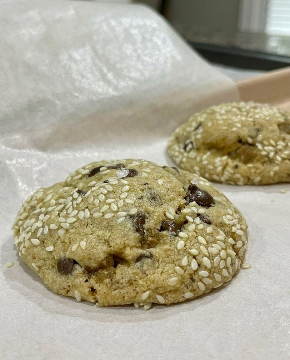 A close up of Tahini Chocolate Chip Cookies showing the soft texture and melting chocolate.
