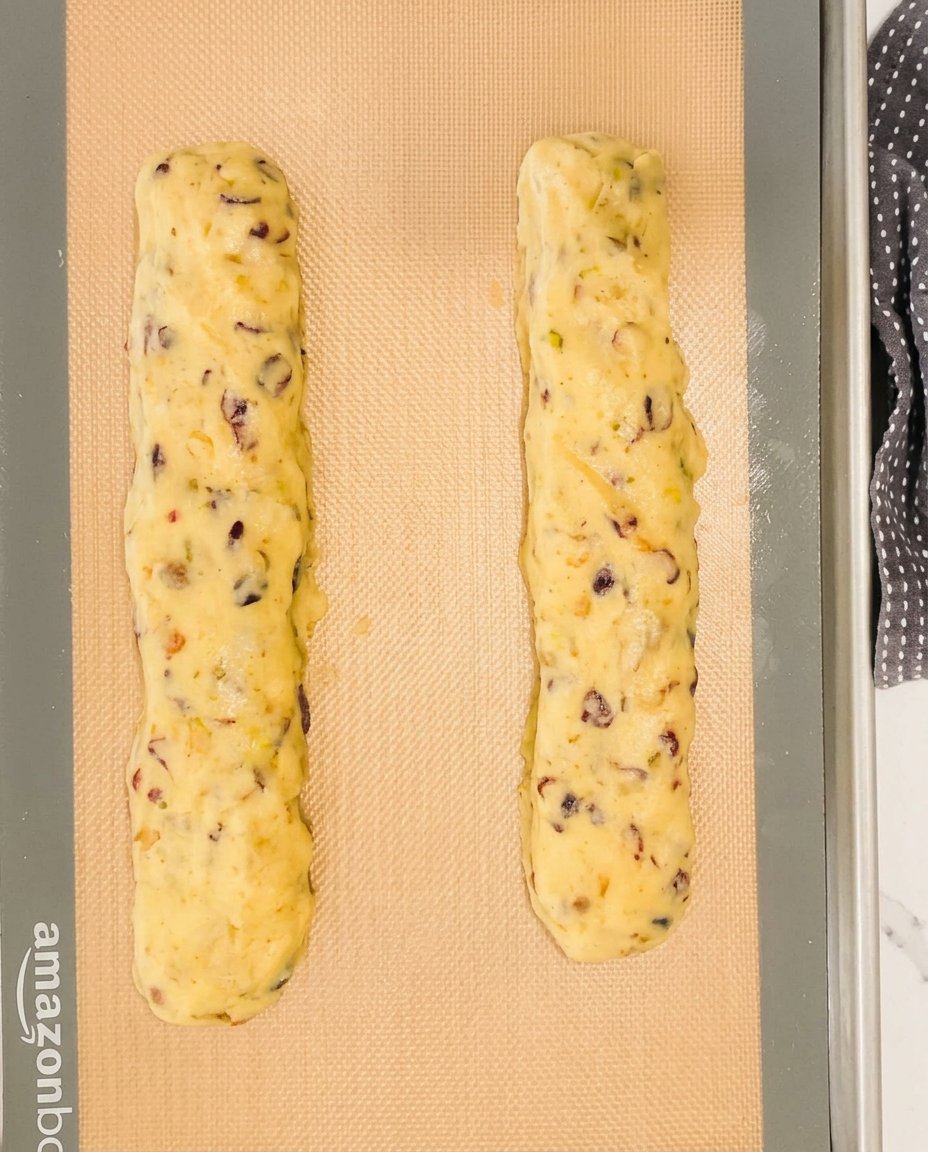 Ingredients for cranberry pistachio biscotti laid out analytically.