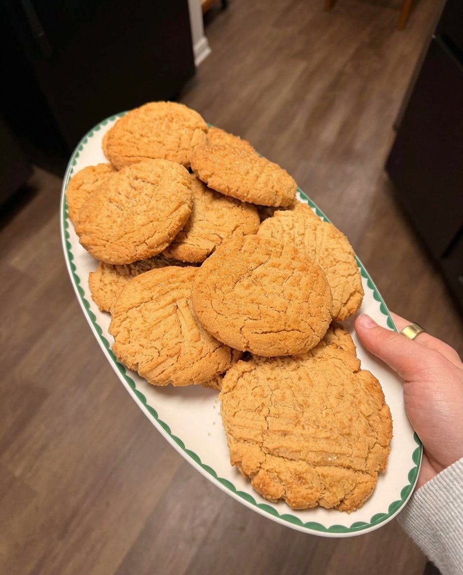 Peanut butter cookies served on a traditional platter with tea