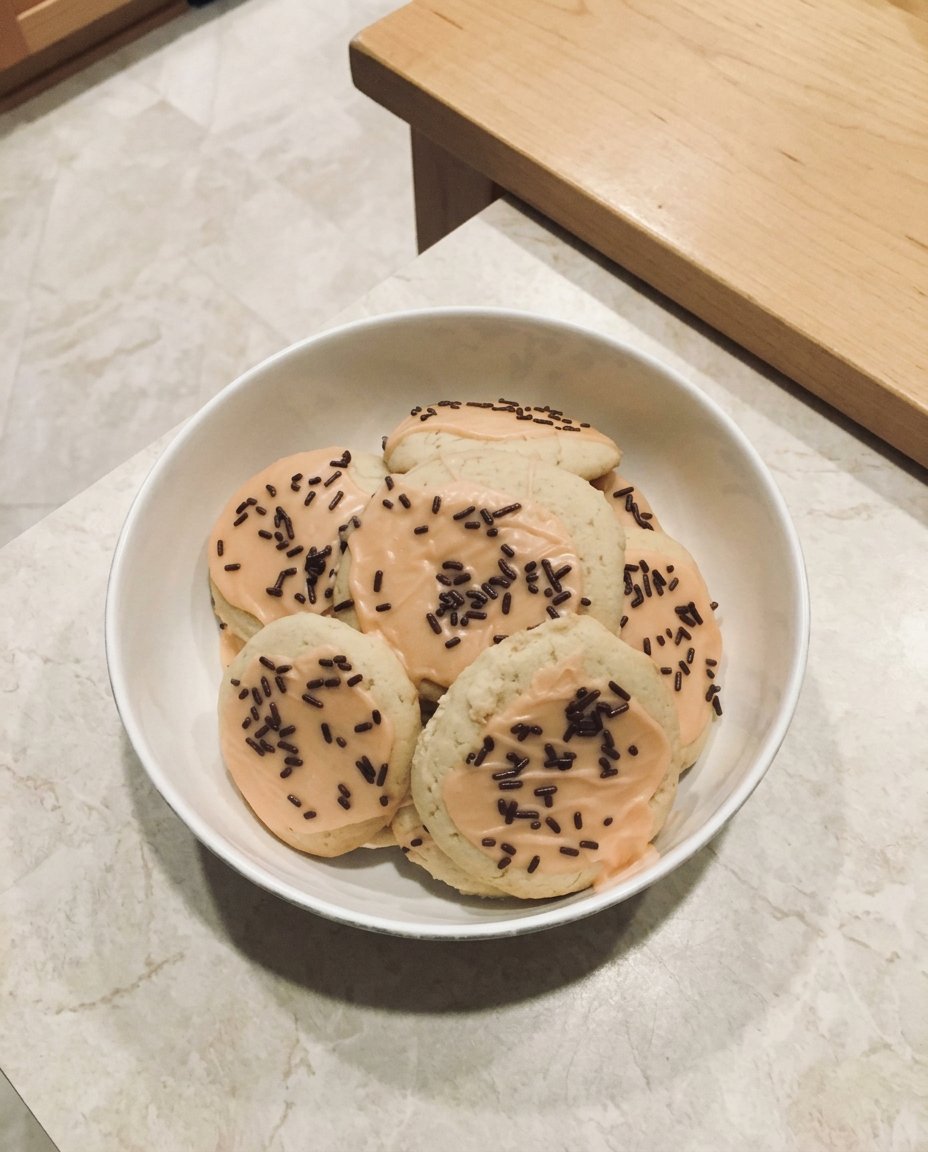 Beautifully decorated vegan sugar cookies with glossy icing.